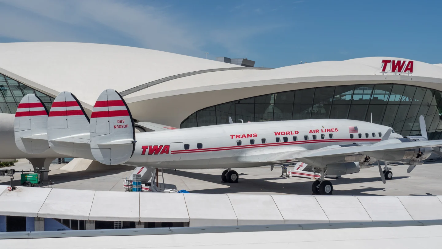 TWA Lockheed Starliner Connie with its distinctive triple tail, parked in front of the Flight Center.